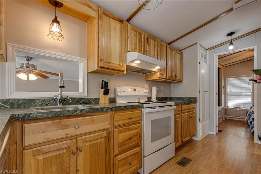 This home is on one of the quietest streets in the park.  This home has been updated in soft grey colors and has drywall as well.  The air conditioning is only 2 years old!  When you enter you immediately feel a sense of calm and relaxation.  This active 55 plus, gated community has everything that you need.  While covid has caused some activities to be curtailed for now, there is still plenty to do from riding your bike, swimming, walking, and much, much more.  This is a place where you actually get to know your neighbors and where everyone says hello. It is only about 8 miles to Marco Island and 12 to beautiful downtown Naples.  It is less than 5 miles to Walmart, Publix, CVS, and Walgreens. Come on down to the beautiful weather and white sand beaches that SW Florida has to offer.  You won't be sorry!  (NOTE:)  The living room and dining room furniture are different that shown.