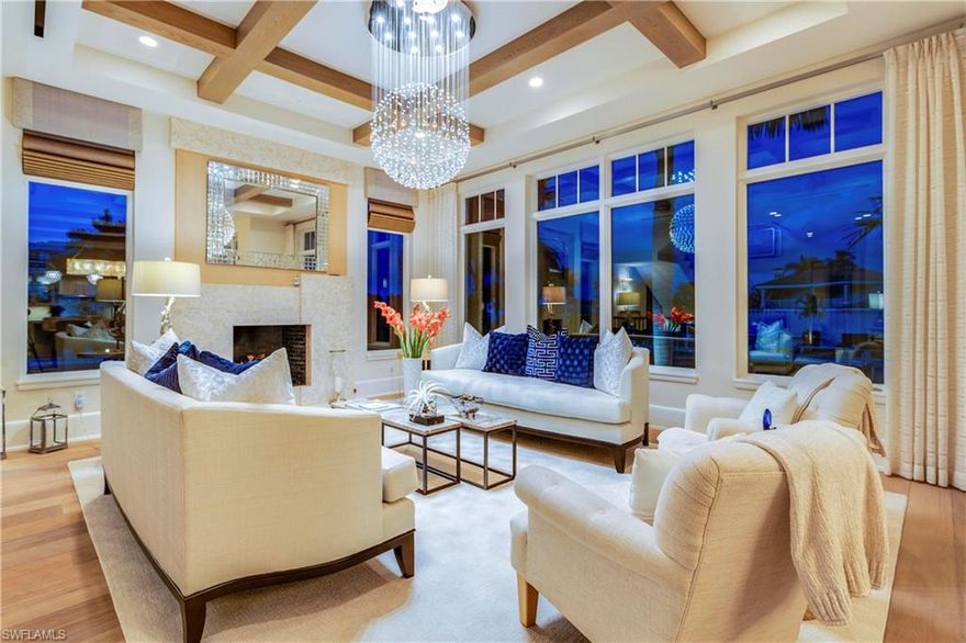 Welcome to 1752 Gulf Shore Blvd N, a rare waterfront gem providing front row seating to stunning panoramic views showcased by dramatic walls of glass and multiple balconies.  Private beach access, steps from the front door, and a private dock with double-boat lifts out your back door, make this home a must-see for those seeking the quintessential waterfront lifestyle in the heart of Naples.  This former model, built by BCB Homes, features an open floor plan with a generous living room, gourmet kitchen, and dining. 12-foot ceilings transition seamlessly out to a sizeable covered terrace that overlooks the waterfront and pool.  The recently updated kitchen, with white quartzite countertops and top-of-the-line appliances, should suit the most epicurean oriented homeowner. For entertaining there’s an expansive covered lanai and pool area with shell stone pavers and an outdoor kitchen framed with quartzite slab. This 4-bedroom plus den, 5-and-one-half bath private end residence also boasts a 4-car garage and a private elevator.   Located just minutes from the finest shopping and dining experiences, Naples Casamore truly offers an incomparable lifestyle!