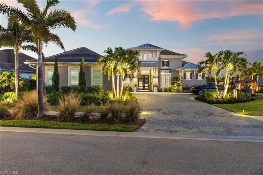 This home belongs in Architectural Digest! With luxury designer finishes throughout. Located in The Isles of Collier Preserve, a luxurious sanctuary nestled in one of Naples’ most prestigious communities. This stunning Cocoplum model by renowned builder STOCK offers the ultimate blend of elegance, comfort, and convenience. Boasting over 3,600 square feet of meticulously designed living space and is located on the most beautiful professionally landscaped lots that would make any garden enthusiast envious. This award-winning home with hundreds of thousands of dollars spent on upgrades is ready to impress everyone that walks through the door. Interior Highlights include 4 Spacious En-Suite Bedrooms: Each bedroom is a private retreat with its own luxurious bathroom, ensuring comfort and privacy for everyone. Prepare your favorite meal while entertaining in your Chef’s Dream Kitchen. The kitchen features a large island, breakfast bar, Thermador professional series appliances, high-end cabinetry, a gorgeous backsplash, and two walk-in pantries, perfect for culinary enthusiasts. With the Open-Concept Living features include soaring ceilings, oversized glass sliders which allows abundant natural light to create an airy and inviting atmosphere, ideal for both serene evenings and vibrant gatherings. Designer Details Throughout: Custom built-ins, coffered ceilings, stunning chandeliers, and elegant finishes make every corner of this home a masterpiece. Private Master Suite: Enjoy two custom walk-in closets, a spa-like bathroom with dual sinks, a walk-in shower, and a soaking tub. Step directly onto the lanai for your morning coffee. Entertainer’s Delight: A built-in bar with wine and beverage coolers, a large living room with a seamless indoor-outdoor flow set the stage for unforgettable moments. Outdoor living highlights include Luxury Lanai: Expansive outdoor space with fireplace, covered and uncovered areas lets you enjoy the Florida lifestyle year-round. Resort-Style Pool and Spa: A saltwater, gas-electric heated pool and spa with stunning waterfalls overlook a serene expansive water view, offering total tranquility. Outdoor Kitchen and Bar: Equipped with a grill, island, and ample seating for alfresco dining. Hurricane Screens: these screens provide enhanced safety and peace of mind. World-Class Amenities: The Isles of Collier Preserve offers lakeside dining at the Overlook Bar & Grill, a resort-style pool, a lap pool, fitness center, tennis, pickleball, bocce ball, and even a dog park. Nature Lover’s Paradise: Enjoy over seven miles of scenic walking and biking trails, paddle-boarding, and kayaking along the Cypress Waterway. Prime Location: Just minutes from historic downtown Naples, Naples Botanical Garden, and the exclusive Hamilton Harbor Private Yacht Club. This exceptional home embodies the perfect blend of privacy, luxury, and convenience, situated on a prime lot with coveted exposure for breathtaking sunsets.