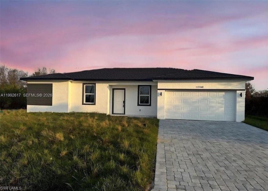 Ready to move in. Experience modern Florida living in this brand-new construction 4-bedroom, 2-bath home in Port Charlotte with no HOA, no CDD, and no rental restrictions. Designed for style and efficiency, this open-concept layout features a spacious great room, dining area, and a stunning kitchen with 42" upper cabinets, quartz countertops, an island and stainless-steel appliances. Enjoy luxury waterproof vinyl plank flooring throughout, In the master bedroom a fully tiled walk-in shower, a private owner’s suite with dual sinks and large walk-in closet. The split floor plan offers privacy for guests or family, with additional three bedrooms and the second full bathroom, which also includes fully tiled shower and tub surrounds. Built with energy-smart features including Low-E windows, water filtration system, high-efficiency mechanicals, and low-flow fixtures, this home helps keep utility costs low. Additional highlights include a paver driveway, 2-car garage, and interior laundry room. Located just minutes from beaches, shopping, dining, and I-75, this home offers the perfect mix of comfort, freedom, and value—without the builder markup. Move-in ready and packed with upgrades—don’t miss it!