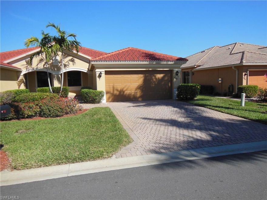 Built in 2005, but seldom lived in lovely 2/2 + den attached villa.  Former model home (2008-2011) with crown molding, tiled in every room except master bedroom, upgraded cabinets, 7 ceiling fans, paved driveway and walk, 2 car garage.  Lake views.  Owners purchased in 2009 as a part time residence and only visit a couple of times per year.  Easy walk to community pool and newer clubhouse and playground.  Great location, very convenient to airport, shopping, both Red Sox and Twin stadiums, Gulf Coast Towne Center Shopping Mall, restaurants, hospitals and beaches.