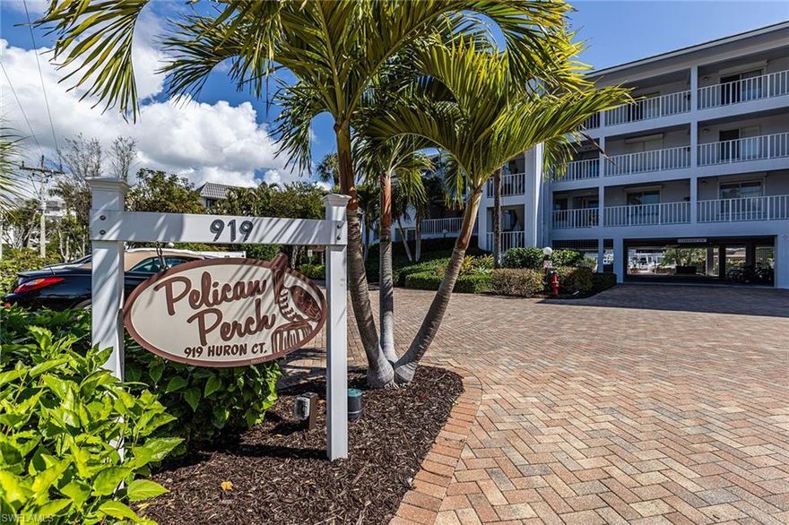 Beach and boater’s paradise found at this exceptional town house in Pelican Perch. Rarely offered 3-bedroom, 2.5 bath two-story residence with over 1,800 square feet of inviting living area. Offering quick and direct boating access with a deeded dock, this tropical getaway is just 2 blocks from the sugary sands of our world-famous beach. Step in through the private entrance to a bright dining area and large updated kitchen with granite countertops, wood flooring, and newer appliances. Spacious, inviting living room and lanai offer scenic pool and canal views. Also, providing easy access to boat slips, sunny pool, grill area, and parking. Second level showcases a large, bright primary bedroom suite including a beautifully updated bathroom, walk-in closet, and a private lanai with its own tropical views. Many other special features include plantation shutters throughout, convenient interior laundry room, storm shutters and two under-building, adjacent parking spaces. This small and pleasant, pet friendly Pelican Perch community offers a large sparkling pool and barbeque area for relaxing and entertaining. Come and enjoy the best of waterfront living on beautiful Marco Island