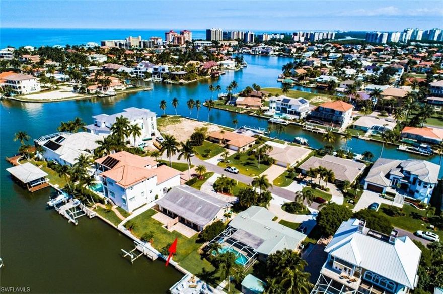 GULF ACCESS WATERFRONT DUPLEX, INCOME PRODUCING, BOAT DOCK AND LIFT. Enjoy owning 4 bedroom/4Bath TOTAL. Each side of this duplex has 2 bedrooms and two baths, with an extra 216 sq.ft. enclosed sunroom that adds more living space to these units. Beautiful southern exposure views from your own private dock with boat lift, enjoy fishing at its finest.  Walk or bike to the beach. Ideal waterfront location in desirable Connors of Vanderbilt, surrounded by multi million dollar homes. Close to shops and many restaurants at Mercato, walk to The Ritz and other Restaurants on Vanderbilt Beach.