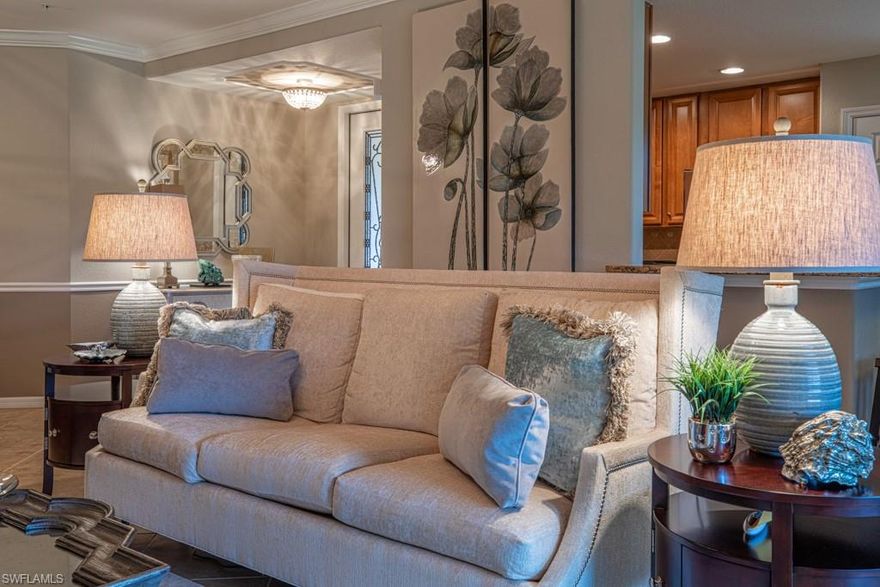 An EXCEPTIONAL property. Absolutely Stunning! Turnkey Furnished. When you enter the front door, the Quality and Style are immediately apparent. It feels like you are walking into a Million Dollar model home. Meticulously cared for. Gorgeous 180 degree serene water views. Beautiful designer furnishings, artwork, accents and lighting fixtures throughout. Custom mill work adds design accents.  Push button remote controlled blinds in both the Living Room and Master Bedroom. Privacy. Williams-Sonoma inspired kitchen. Natural Gas cooking. 3 Bedrooms, 2 Baths, 2 Car Garage, Impact resistant windows. Tankless hot water. Steps away from luxurious neighborhood pool.  Spectacular main FC Club House. Two restaurants, 4 Pools, Tennis, Pickle Ball, Pro Shop, Fitness Center with personal trainers and classes. Full Service Spa and a Children's Play Area. Award winning Golf, Marco Island Beach Club and Marina with Seasonal and Annual Memberships, all optionally available. Fiddler’s Creek--one of the finest Resort Style communities in Naples with a vibrant lifestyle and a "jam packed" social calendar. Please visit. You will not be disappointed. (Agents-see remarks: Furnishings-minor exclusions)