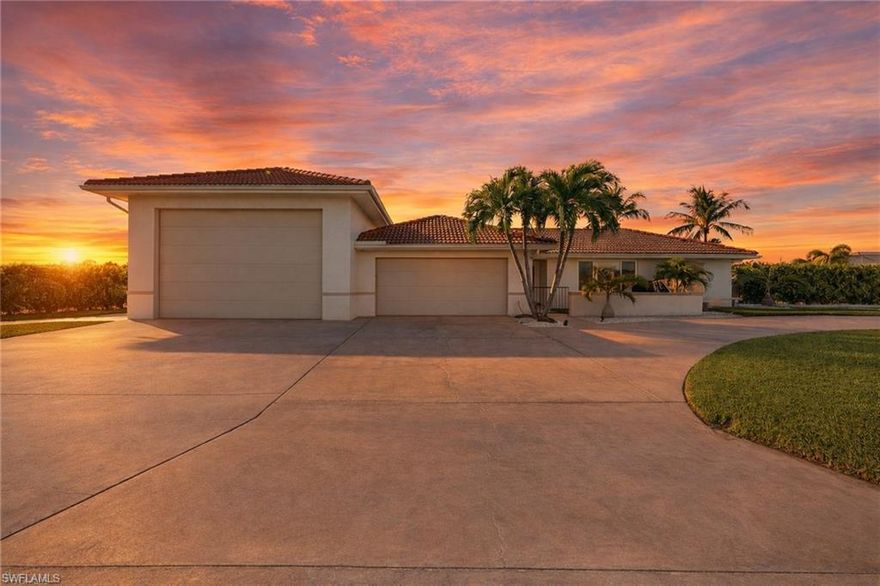 A rare and refined offering in the heart of Cape Coral, this oversized, south-facing Gulf access triple lot presents an exceptional blend of luxury, space, and waterfront lifestyle. Tucked within one of the area’s most sought-after locations, this beautifully reimagined residence delivers both elegance and functionality with effortless coastal sophistication.

The home features updated baths, complemented by a thoughtfully designed open-concept layout that feels both inviting and elevated. At the center of the outdoor experience, a stunning, resort-style pool has been fully remodeled to create a private oasis, perfectly paired with a well-appointed summer kitchen designed for seamless entertaining.

For the boating enthusiast, a substantial covered boat lift offers quick, direct Gulf access, placing world-class beaches, fishing, and waterfront dining just moments away. Car collectors, RV owners and hobbyists will appreciate the nearly 1,700 square feet of air-conditioned garage space, an extraordinary feature rarely found, along with an expansive circular driveway that provides both convenience and an impressive arrival experience.

Set on a sprawling triple lot, the property offers an abundance of green space, ensuring privacy and room to expand, entertain, or simply enjoy the Southwest Florida lifestyle at its finest.

This is more than a home, it’s a statement. A true SWFL dream property where luxury, lifestyle, and location converge.