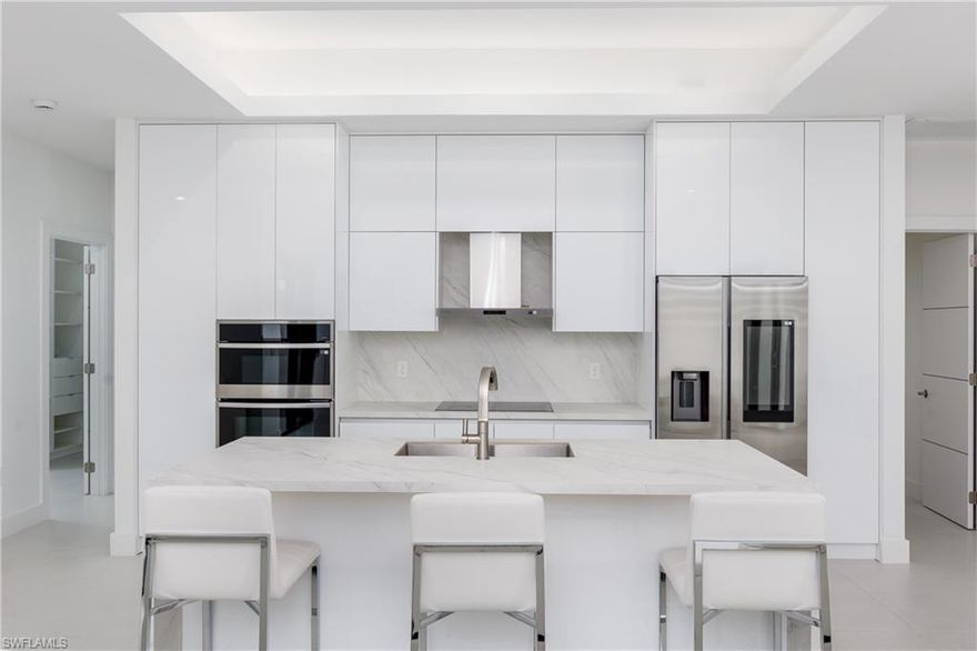 This beautifully crafted 3-bed, 2-bath home offers a spacious, open concept design with high-end finishes throughout. The gourmet kitchen boasts an oversized stone island, stainless steel appliances, and custom cabinetry. The great room features a large living area, dining space, and a versatile nook perfect for a home office or cozy entertainment spot. The master bath is a luxurious retreat with a soaking tub, walk-in shower, and dual vanities. Additional perks include high ceilings, custom Italian-style doors, built-in closets, an extra room for storage, ceiling fans on the outside patio, and a reverse osmosis system. Enjoy the patio and serene surroundings. With a double car garage and washer/dryer for added convenience, this home truly has it all. Schedule a tour today!