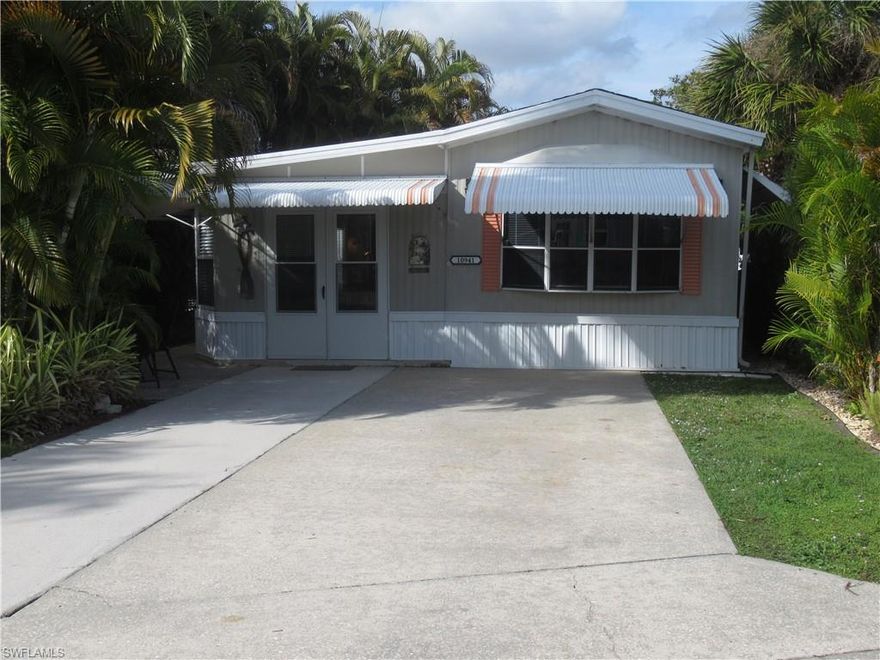 Welcome to Corkscrew Woodlands, a gated 55+ community offering an active Florida lifestyle. This Knopf Park Model features a welcoming double-door entry, a two-car driveway, and a 9x12 guest room with a private exterior entrance—ideal for guests or flexible living. Also, the living room has a sofa couch for guests. The laundry room is attached to the back of the home and includes a full-size washer and dryer. The AC unit was replaced in 2023, providing added comfort and peace of mind. Residents enjoy a vibrant community with numerous social activities, conveniently located near Southwest Florida beaches, dining, and shopping.