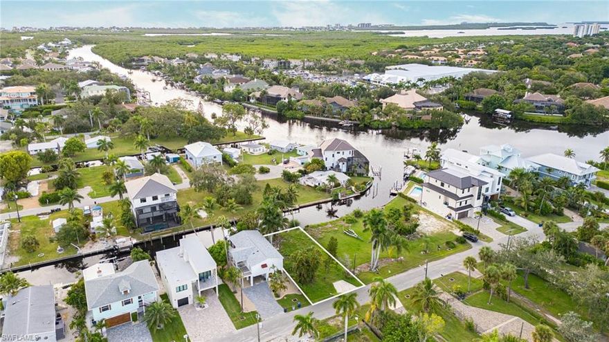 RARE GULF ACCESS LOT WITH PRIVATE BOAT RAMP.  An extraordinary opportunity awaits on one of Bonita Springs’ most coveted streets. This nearly 4,800 sq. ft. gulf-access homesite offers a feature impossible to replicate today:  a grandfathered-in private boat ramp, delivering peace of mind for your prized watercraft, as well as effortless direct access to the Gulf from your own backyard. With approximately 50 feet of water frontage and located just three doors from Imperial River, this lot combines exceptional boating convenience with the tranquility of waterfront living. Its position just 1.5 miles from the sugar sand coastline ensures a lifestyle seamlessly connected to Southwest Florida’s most desirable coastal experiences, all the while just moments from the town's numerous sought-after restaurants and shops. Surrounded by multi-million-dollar new construction estates, the setting underscores both prestige and long-term value. With AG-2 zoning and no HOA restrictions, this property offers unmatched freedom to design and build your dream estate, whether that's a modern coastal retreat or timeless waterfront residence. Opportunities of this caliber are exceedingly rare.  Its combination of location, water frontage, and exclusivity makes it a truly distinguished offering in today’s market.