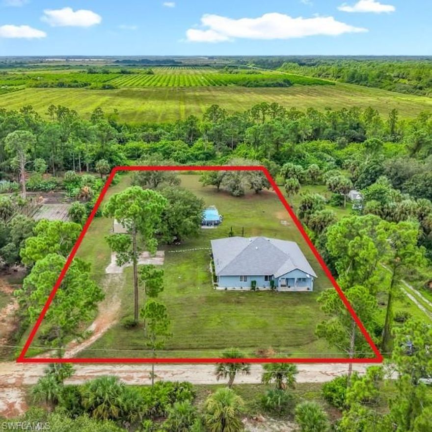 This spacious five-bedroom, two-bathroom concrete block home offers the perfect balance of modern comfort and quiet country living. Set on 1.25 private acres in Hendry County, the property is ideal for families, pets, and anyone looking to enjoy a rural lifestyle without sacrificing convenience. The home features 2,881 total square feet with 2,186 square feet under air, and has been updated with a brand-new shingle roof, new central air conditioning system, new water heater, and new water softener.

The interior boasts an open great room design with living and dining areas flowing seamlessly into a chef’s kitchen. Highlights include a twelve-foot granite island designed for entertaining, a stainless farmhouse sink, granite countertops, interchangeable cabinet panels, and a full suite of modern appliances including a French door refrigerator, dishwasher, microwave, and stove. The laundry room is equipped with a full-size stack washer and dryer, cabinetry, folding counter, and additional linen storage. Durable flooring enhances the home throughout, with ceramic tile in the main living spaces and baths, and luxury vinyl plank in the bedrooms—ideal for both kids and pets.

The primary suite is generously sized to accommodate a king bed and features a walk-in closet, wall-mounted television, and an en-suite bathroom with a dual-head walk-in shower. Four additional bedrooms provide ample flexibility for family, guests, or office space, and the guest bath includes a large vanity and oversized linen closet.

Outdoor living is equally impressive, with a 15’ x 30’ screened back porch, a canopied front porch, a 16’ x 32’ above-ground pool, a 10’ x 14’ garden shed, and backs up to a greenbelt for “no neighbors back yard”. A chicken coop, with chickens available if desired, adds to the property’s charm. With a private well and new softener system, as well as plenty of space for gardening, pets, and hobbies, this home is truly move-in ready. Offering thoughtful updates, spacious design, and a peaceful rural setting, it is a rare find for those seeking both comfort and practicality.