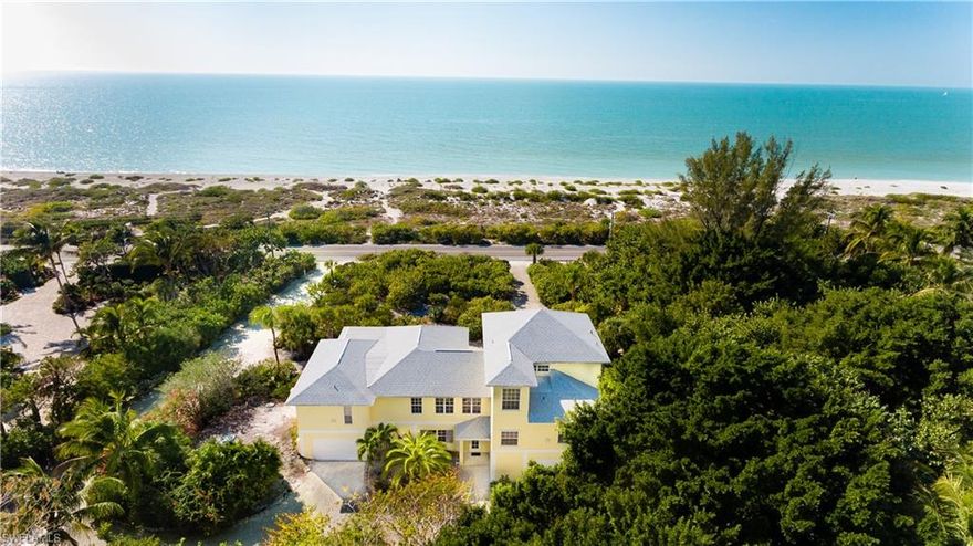 Uniquely charming and invitingly warm, this stunning Gulf-front home on Captiva offers tropical island living at its finest. Featuring 157 feet of beach frontage and a boat dock on Roosevelt Channel, this home offers a rare and coveted attribute of both a beachfront location and the ability to dock a boat up to approximately 40 feet in length. Located on a private road and shared with only three homes, this Gulf-front home has an impressive beach frontage with an expansive 180-degree view that looks out to the Gulf and down the beach. Built in 1998 by luxury homebuilder Sandcastle Construction, this home has four bedrooms, a den/office, three-and-a-half baths, Gulf views from almost every room, a new roof installed in 2017 and a new pool added in 2015. The open floor plan offers stunning views through an abundance of windows, a large kitchen with breakfast bar, beautiful wood floors and a master suite replete with a private balcony.