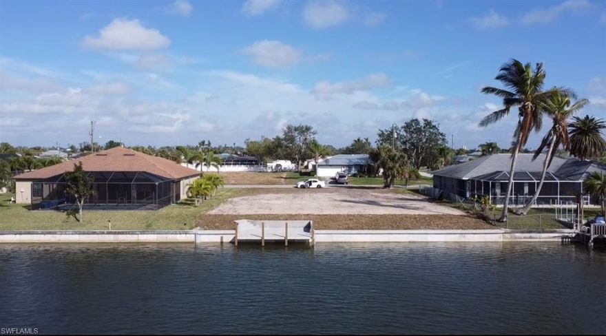 Are you ready to build your new home in Cape Coral? Prime freshwater intersecting canal lot on Gainsborough Canal with southern view down Mohican Canal. Do not let this lot pass you by. This south facing lot is ready to be built on. Features a brand new seawall outfitted with a concrete dock, ready for you to drop a line in the water and fish in your new Florida getaway. This South facing lot, comes with unobstructed views down basin of the canal and give you the view EVERYONE is looking for. The canal system goes to Seminole Lake, Mohican Lake, Apache Lake and Cherokee Lake. Plenty of good fishing off your dock or go to the lakes. City Water and Sewer are in and paid in full.