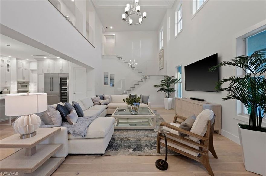 Nestled on an oversized corner lot just one mile from 5th Avenue, this breathtaking new construction home will be sure to please. With over 3,200 square feet of luxurious living space, this residence, crafted by the renowned Wilder Builders of Naples, is being offered fully furnished by Clive Daniel. Featuring 4 generously sized bedrooms, an office, 4.5 bathrooms, soaring ceilings, and an open-concept great room, this home is the epitome of modern elegance. Enjoy seamless indoor-outdoor living with a gourmet kitchen, Thermador appliances, custom cabinetry, detailed trim work, T&G ceiling accents, wood floors, and floor-to-ceiling tile in the bathrooms. The outdoor area is equally impressive, with a fully equipped kitchen, heated pool and spa, and a built-in sauna, all set against lush landscaping on a spacious 160-foot deep lot. The expansive green space creates a private oasis, perfect for enjoying the best of Naples living. Located just east of Royal Harbor, behind the Naples Bay Club, this rare find offers unbeatable proximity to 5th Avenue and the Gulf of Mexico. For even more opportunity, this home can be purchased with the adjacent vacant land at 1972 Frederick Street.