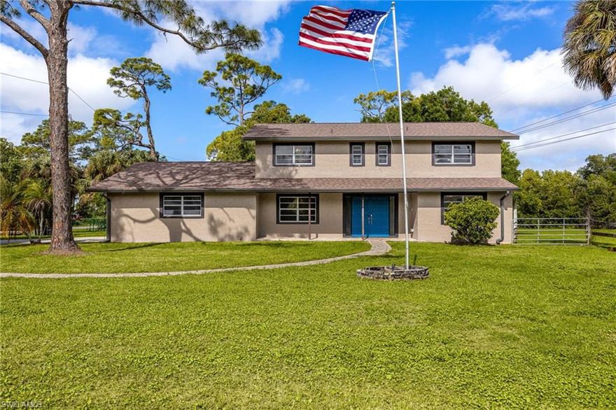 Incredible opportunity on over an acre with NO HOA and AG-2 zoning in North Fort Myers, offering a rare combination of space, flexibility, and privacy that’s increasingly harder to find. Welcome to this fully upgraded, move-in ready 5-bedroom, 2.5-bath home, thoughtfully designed for both comfort and freedom. Whether you need room for boats, RVs, a workshop, or future expansion, this property delivers the space to live how you want, without restrictions and all while being conveniently located near major roadways, shopping, and dining. Step inside to a bright, refreshed interior featuring stunning wood plank tile flooring with modern baseboards throughout the first floor and fresh paint that enhances every space. The kitchen is a true centerpiece, showcasing brand-new shaker cabinetry, stainless steel appliances, and a layout perfect for entertaining and everyday living. Upstairs, enjoy the durability and style of luxury Pergo flooring, with select areas of original wood adding warmth and character. Feel confident in your investment with major upgrades already complete, including a 2024 roof, new soffit, fascia, and gutters, a new water heater, elevated A/C units, and a fully remodeled downstairs bathroom. Additional features like a monitored ADT security system, central vacuum, upgraded baseboards, and a newly installed (2025) water jet pump add even more value and peace of mind. This is a rare opportunity to own a beautifully updated home with acreage, freedom, and modern upgrades already in place. Schedule your private showing today and experience the space, comfort, and lifestyle this property offers.