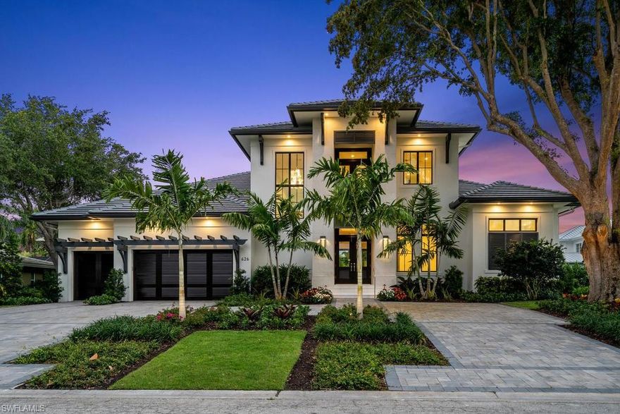 Situated on quiet Parkview Lane, 626 embodies the ultimate indoor-outdoor Naples lifestyle to provide an uplifting & peaceful retreat. Mahogany and glass front doors opens to clear views through the open concept main living area out to the expansive outdoor living space. Outside, the southern exposure pool deck features custom pool & spa, fire table, covered outdoor kitchen & dining, and lounge spaces to enjoy warm sunshine and relaxing shade. Scenic views to the west from the balcony over lush treetops offer the perfect way to enjoy a famous Naples sunset. Inside, an impressive 3-sided glass temp controlled 270 bottle wine display (or future elevator in place of display) sets the stage for the home, which boasts Legno Bastone white oak floors, custom cabinets, chef's kitchen complete with Sub-Zero/Wolf gas appliances, and exquisite finishes and features throughout. The lovely master suite, office, Jr. Master suite, & laundry complete the first floor. A large upstairs loft space with two balconies & two en-suite guest rooms complete the home. Park Shore residents enjoy optional HOA membership with private beach park access & option to purchase boat slip at Venetian Bay Yacht Club!