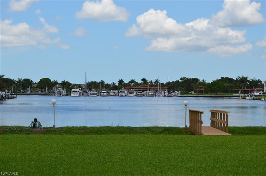 ONE WORD DESCRIBES THIS  CONDO....... GORGEOUS!!!! SPECTACULAR WIDE LONG WATER VIEWS INCLUDES USE OF A BOAT PARKING SPACE, PARALLEL TO SEAWALL WITH DIRECT ACCESS TO THE GULF OF MEXICO AND THE 10,000 ISLANDS.  This BEAUTIFUL 2 bedroom 2 bath condo shows like A MODEL HOME. MOVE IN READY!!!  OVER $40,000 IN UPGRADES. The kitchen has many upgrades including granite counter tops under cabinet lighting, stainless steel appliances, and tile back splash.  20" Floor Tile on the diagonal throughout the Condo.  Want a Beautiful Master Bath?  This one has a huge walk in shower with double sinks, granite counter top and designer faucets.  The 2nd bath is also totally remodeled with tile around tub and marble counter tops
The large patio/lanai has sun shades and offers SPECTACULAR WATER, MARINA VIEWS AND BEAUTIFUL SUNSETS. DON'T MISS THIS ONE, IT IS MUST SEE CONDO!!!
This is a wonderful BOATING COMMUNITY, with a Marina, Ships Store, Restaurant and some of the BEST FISHING IN FLORIDA.  Close to restaurants, shopping and only 15 minutes to Naples or Marco Island.