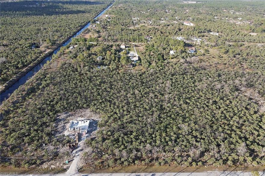 Beautifully wooded 2.5-acre single-family lot in Golden Gate Estates offers space, privacy and is located in an upcoming area. Great price for great size. Don't miss out.