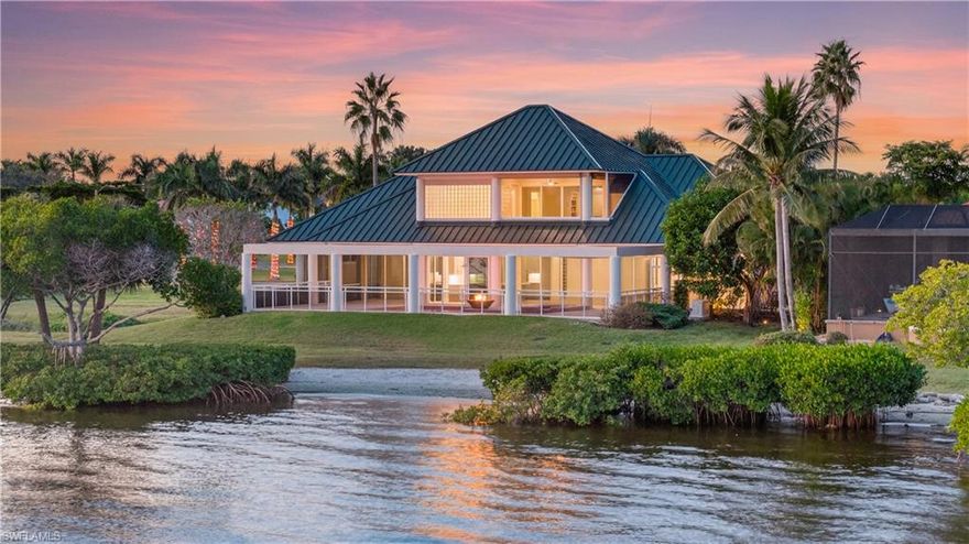 Direct Riverfront Estate in Buttonwood Harbor, a gated luxury enclave along the Caloosahatchee River between Cape Coral and Fort Myers. This rare 0.51-acre parcel sits directly on the River with a sandy beach in the backyard and a 30-foot boat slip in the community-maintained canal—offering a lifestyle where every day feels effortless. The 3,600 sq ft residence features an oversized 3-car garage, 4 Bedrooms, and 4 Full Bathrooms, anchored by a Standing Seam Metal Roof installed by Crowther Roofing in 2023—renowned for superior durability, wind resistance, and strong insurance appeal. Current policies reflect excellent insurability for a waterfront home, with flood coverage at $2,200/year and homeowners at $8,650/year. The entire first floor was extensively remodeled with high-end finishes, including new engineered wood flooring, custom cabinetry, quartz countertops with a full kitchen backsplash, designer bath tile, new shower enclosures, 8’ solid-core interior doors, enhanced closet systems, and comprehensive plumbing and electrical upgrades. Sliding glass doors, drywall, paint, and finish carpentry were all refreshed, giving the main level a clean, refined, turnkey interior. Upstairs, the primary suite—preserved with its original custom finishes—offers endless possibilities for you to personalize and create a sanctuary of your own. Additional enhancements elevate both comfort and peace of mind: Electric roll-down shutters protect the southern exposure, while a whole-home generator with two underground propane tanks ensures uninterrupted power and provides instant heat to the open-air pool and spa. The propane system also fuels the poolside fire pit, creating the perfect setting for evenings by the water. Living in Florida in a direct riverfront home is a dream come true at 12540 Panasoffkee Drive. Located just 10 minutes to Downtown Fort Myers, this boating community offers tennis and pickleball courts—close enough to stay connected, yet secluded enough to unwind and disconnect. Grab a good book and a cold drink; listen to the waves touch your private beach as you read. Host holidays with ease, with plentiful parking and generous gathering spaces. Live your best Florida life—the way it was meant to be lived. This is the best priced, move-in-ready, direct waterfront home on the market today!