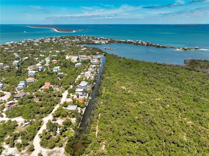 Very rare opportunity to purchase a vacant land parcels on the southernmost North Captiva Island canal bordering the state preserve! A well-designed home's upper levels will offer unobstructed views across the state wildlife reserve to Pine Island Sound, plus vistas over the entire preserve and island to the Gulf for beautiful sunsets. It is located adjacent to a neighborhood HOA double-sized parcel at the end of the canal, which offers extra green space to the south. If you are looking for great views, private dockage for multiple boats, and privacy while close to the beach, this lot may be the one for you!