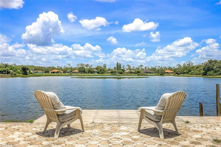 At last! The home of YOUR dreams has arrived. Enjoy long LAKE views all year long in this 3 BR, 2 BA, 2 PLUS car garage, POOL home, situated on an EXTRA LARGE lot with its own "island."  This beautifully updated home is located in the highly sought after NON GATED community of Lakes Of Sans Souci. Upon entering, you will be impressed by the spacious great room with living, dining & kitchen all open to one another. This home, with vaulted ceilings & gorgeous wood look tile throughout was completely updated in 2018! Updates also include impact windows & sliding glass doors. The enclosed lanai space, accessible through LR & master bedroom, offers indoor/outdoor living all year round! This home will be your private oasis with so much open space for entertaining PLUS a pool with a dock! YES, you can kayak/canoe in the lake behind the home & the view is spectacular! Minutes from the famous Barefoot Beach, fine dining, world class shopping & the charming downtown area, this is truly the perfect location in Bonita Springs! Bike to coffee shops, wine bars, restaurants, art festivals & more. You will fall in love with this gem -- homes of this caliber AT THIS PRICE are rarely available!!