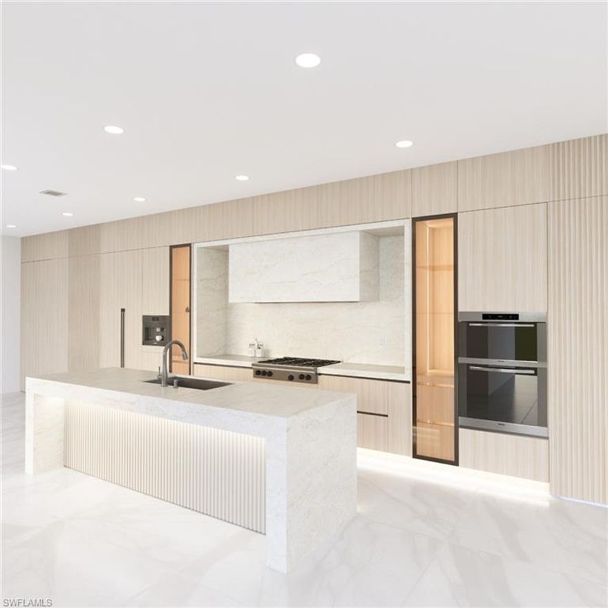 Luxury is rising on the coveted south end of Fort Myers Beach, where this 7-bedroom, 7-bath all-concrete waterfront showpiece—expected to be completed this fall—is set to become one of the most ambitious new homes on the island. Designed for both resilience and refined coastal living, the home features expansive walls of glass, oversized sliding doors, and multiple terraces that capture natural light and water views from nearly every level.

Located directly on a deep-water canal with quick Gulf access, the property is ideal for boating enthusiasts and will feature a private boat lift and double jet ski lift for effortless days on the water.

The interiors showcase a modern architectural aesthetic with 48” x 48” porcelain flooring throughout the main living areas, dramatic 60” x 120” Italian porcelain in the primary bath, porcelain and marble finishes in secondary baths, quartzite countertops, and Level 5 smooth wall finishes. The chef’s kitchen will be equipped with a fully integrated Miele appliance package, including panel-ready refrigerator and freezer columns, 48” gas cooktop, oven, steam oven, microwave, and built-in coffee system. Additional highlights include two coffee stations, four high-efficiency Carrier HVAC systems, three tankless water heaters, integrated sound, CCTV security, and an oversized elevator servicing the main living levels.

Outdoor living centers around a spectacular 12’ x 40’ infinity-edge saltwater pool and spa with Pentair heating and automation, creating a private resort-style setting.

The rooftop plaza deck offers breathtaking 360-degree views of the Gulf, Estero Bay, and the island skyline, providing a rare elevated outdoor living space perfect for sunset entertaining.

Buyers who secure the property during construction may have the opportunity to participate in the final finishing selections, allowing for personalization of this exceptional residence.

Positioned directly on Estero Boulevard, the property also offers excellent vacation rental potential, with its seven-bedroom layout, luxury amenities, and prime south-end location making it a strong candidate for high-income producing rentals.