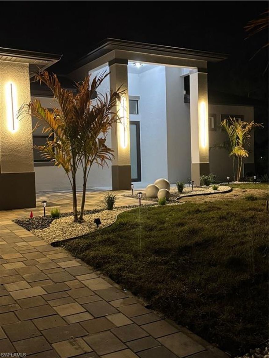 Stunning brand-new modern residence offering 3 bedrooms, 2 bathrooms, plus a beautifully designed private Mother-in-Law Suite — ideal for extended family, guests, or additional income potential.
From the moment you enter, you’re welcomed by a striking designer accent mirror that enhances the foyer and sets the tone for the home’s modern elegance. The open-concept layout features polished large-format tile flooring, impact-resistant windows and doors, modern architectural lighting, and a custom-built entertainment wall complete with an electric fireplace and illuminated niches.
The oversized chef’s kitchen is a true showpiece, boasting a spacious quartz island, contemporary cloud-gray appliances, designer backsplash, and a dedicated coffee and wine station with built-in pantry — blending luxury and functionality seamlessly.
The private Mother-in-Law Suite offers its own bedroom, full bathroom, walk-in closet, and kitchenette equipped with sink, microwave, refrigerator, and a convenient 2-in-1 washer/dryer — providing privacy and flexibility for multi-generational living or income potential.
Step outside to the expansive screened-in lanai, complete with ceiling fan, creating the perfect space to relax or entertain year-round while enjoying Florida living in comfort.
Additional highlights include a spacious laundry room with utility sink and matching designer backsplash, modern washer and dryer included, paved driveway, professionally designed landscaping, and a full-house reverse osmosis water filtration system providing clean, high-quality water throughout the entire home.
Luxury, versatility, and elevated design all in one exceptional property.