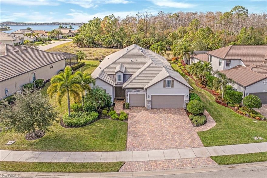 Enjoy peaceful PRESERVE VIEWS and glowing sunsets in this FULLY FURNISHED STONEWATER MODEL, featuring a MASSIVE EXTENDED LANAI with a PANORAMIC frameless screen to take in the gorgeous views, & a FULL OUTDOOR KITCHEN WITH BUILT-IN GRILL, HOOD, BEVERAGE COOLER, SINK, GRANITE COUNTERS, AND STACKED STONE ACCENTS—perfect for outdoor entertaining! Big-ticket upgrades include HURRICANE IMPACT WINDOWS AND DOORS plus STORM SMART MOTORIZED HURRICANE SCREENS on the lanai already in place. Inside, the wide-open layout offers nearly 2,900 sq ft of single-story living with WIDE PLANK TILE FLOORING in the main living areas, den & primary suite, & CROWN MOLDING, SOLID CORE 8-FOOT DOORS, & PLANTATION SHUTTERS throughout. The kitchen is designed for gathering with SOFT-CLOSE CABINETRY, DOUBLE PULL-OUT SHELVING, ADDED ISLAND STORAGE, QUARTZ COUNTERTOPS, CUSTOM WALK-IN PANTRY WITH SHELVING TO THE CEILING, BUILT-IN KITCHENAID STAINLESS APPLIANCES, and an EXTRA-LARGE SINGLE-BASIN SINK. Just off the kitchen is a dining nook with a BUILT-IN ENTERTAINMENT BAR and BEVERAGE COOLER.  You also have a large formal dining area that flows seamlessly from the main living space. The private primary suite overlooks the preserve and features a TRAY CEILING, LUXE BATH WITH SOAKING TUB and FRAMELESS GLASS SHOWER, DUAL QUARTZ VANITIES, CUSTOM MIRRORS, & even a TV! The DREAM CUSTOM WALK-IN CLOSET has shelving built all the way to the ceiling for maximum usability.  2 guest bedrooms offer flexibility, each with adjacent full bathrooms featuring CEILING-HIGH TILE SHOWER, QUARTZ COUNTERS, and COMFORT-HEIGHT CABINETRY. They both have pocket doors to the suites - which is ideal for hosting while maintaining privacy. Plus you have a DEN with double doors which is the perfect office space or 3rd guest room! The laundry room is exceptionally outfitted with WHIRLPOOL FRONT-LOAD WASHER AND DRYER, UTILITY SINK, & FULL WALL OF CUSTOM CABINETRY WITH QUARTZ COUNTERS. Rounding it out is a 3-CAR GARAGE WITH A 4-FOOT EXTENSION, PULL-DOWN ATTIC STAIRS, FLOORED, LIT, AND INSULATED ATTIC STORAGE, plus GARAGE STORAGE CABINETS THAT CAN CONVEY with the sale. This exquisite property is tucked away on a QUIET CUL-DE-SAC in the highly sought-after Corkscrew Shores.  This gated community is designed around a resort-style lifestyle, with the amenities set on a scenic peninsula overlooking a stunning 240-acre lake, featuring a stunning pool, fitness center with classes, pickleball & tennis, kayaking, fishing pier, and the Captain’s Club full-service restaurant, offering a private country club feel without the golf. The community pairs an active social atmosphere with a relaxed Southwest Florida vibe, all while being just minutes from I-75, Miromar Outlets, RSW Airport, & close to Naples, Estero, Fort Myers, and nearby beaches. With NO CDD, proximity to top golf courses like Old Corkscrew & Stoneybrook, and exceptional convenience, Corkscrew Shores delivers luxury living without mandatory memberships or high fees.