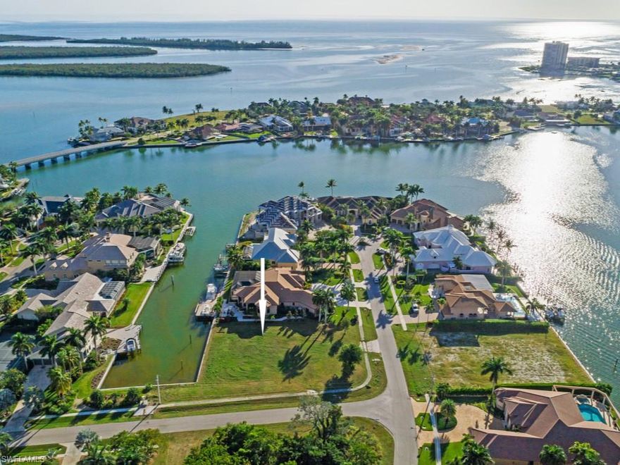 This is a fantastic location for your dream home in the Estates of Marco offering fast water direct access by boat to the Gulf of Mexico, Ten Thousand Islands and Caxambas Pass! Located at the corner of Copeland Drive and Doxsee Terrace in a luxury neighborhood of large elegant residences make this a premium location! Offering 166’ of seawall (replaced in 2004), there is plenty of room for a yacht or several seaworthy vessels at this highly desired SE and SW exposure location. There was a home here previously, so expect potential credits for the cost of impact fees associated with your future residence.