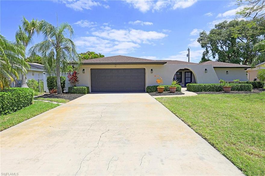 Check see this amazing 3 bedroom, 2 car garage pool home with over1700 square feet of living square footage situated on a fully fenced in lot for your privacy. The home has both a living room area and either a family room or den that can be a great work from home space, tv room or playroom, the possibilities are endless. The assessments are all in and paid so no stress there and it also has a newer roof in 2023. Come inside, there's a beautifully remodeled large kitchen with gorgeous posh wood cabinetry, stainless steel appliances, granite countertops, a built in pantry and a separate matching bar area with extra cabinetry. Both bathrooms have been remodeled with the primary boasting dual sinks and a beautifully tiled shower with a glass Listello border. Outside however is where things really heat up with a gorgeous resort style pool and a large deck with plenty of room for entertaining guests or peacefully relaxing in the sun.. All of this and so much more while being close to downtown, the new Bimini Square waterfront development and just a short walk or golf cart ride to the possible new city park area, the possibilities are literally endless. Just a quick trip to shopping and dining in the Downtown Entertainment District, Midpoint, Tarpon Point, Cape Harbour etc. and an easy commute to Fort Myers. This house is close to it all and just ready and waiting for you to make your own.