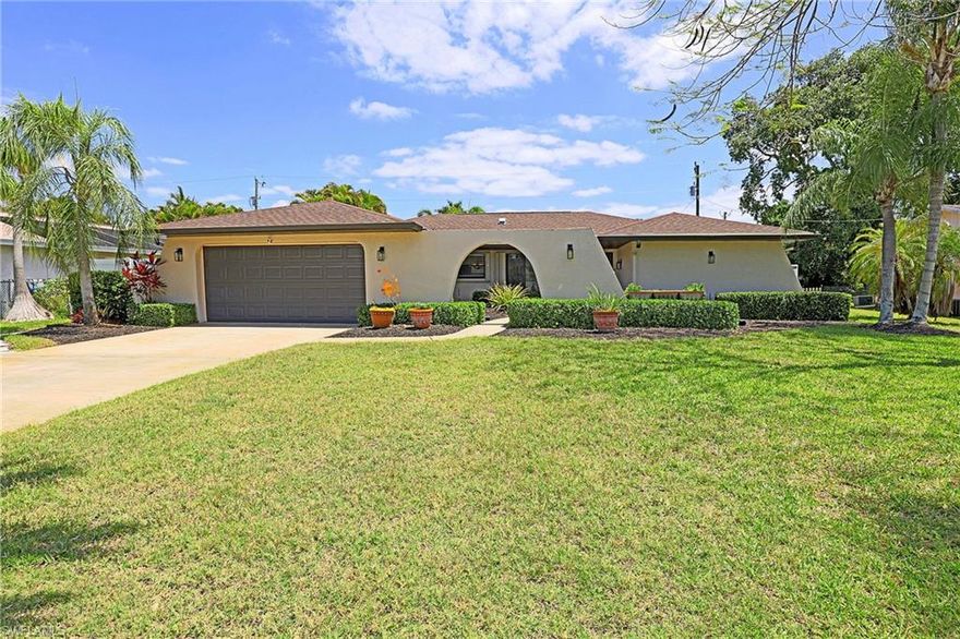 Check out this amazing 3 bedroom, 2 car garage pool home with over1700 square feet of living square footage situated on a fully fenced in lot for your privacy. The home has both a living room area and either a family room or den that can be a great work from home space, tv room or playroom, the possibilities are endless. The assessments are all in and paid so no stress there and it also has a newer roof in 2023. Come inside, there's a beautifully remodeled large kitchen with gorgeous posh wood cabinetry, stainless steel appliances, granite countertops, a built in pantry and a separate matching bar area with extra cabinetry. Both bathrooms have been remodeled with the primary boasting dual sinks and a beautifully tiled shower with a glass Listello border. Outside however is where things really heat up with a gorgeous resort style pool and a large deck with plenty of room for entertaining guests or peacefully relaxing in the sun.. All of this and so much more while being close to downtown, the new Bimini Square waterfront development and just a short walk or golf cart ride to the possible new city park area, the possibilities are literally endless. Just a quick trip to shopping and dining in the Downtown Entertainment District, Midpoint, Tarpon Point, Cape Harbour etc. and an easy commute to Fort Myers. This house is close to it all and just ready and waiting for you to make your own.