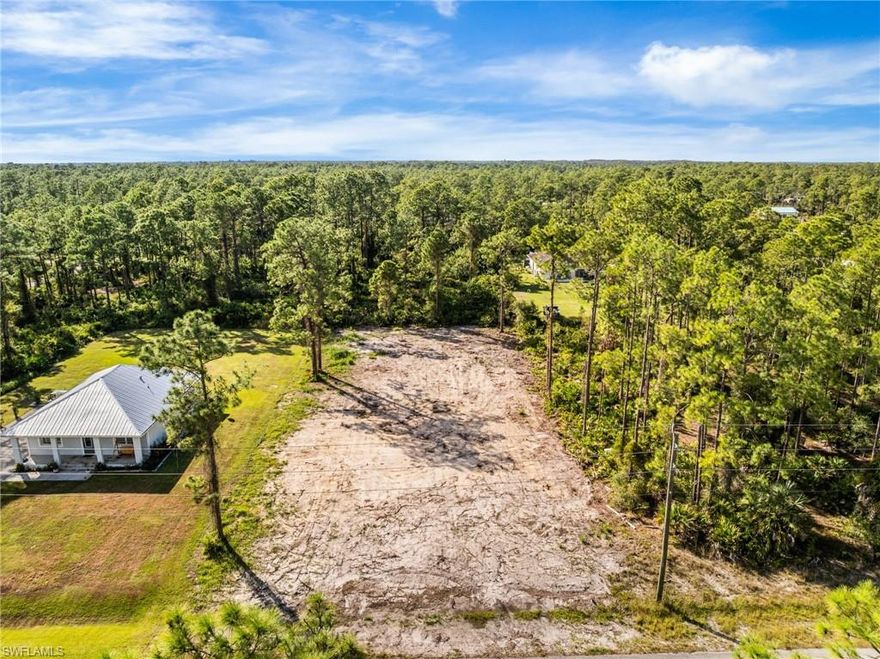 HALF ACRE CLEARED lot with a beautiful home next door and good neighbors!  The big expense of clearing the lot and surveying has already been done for you!  It's ready for you to design and build your new home in Paradise!
NO protected wildlife, NO high risk flooding ~ Flood zone X, NO HOA fees, No flood insurance, NO clearing needed!!!