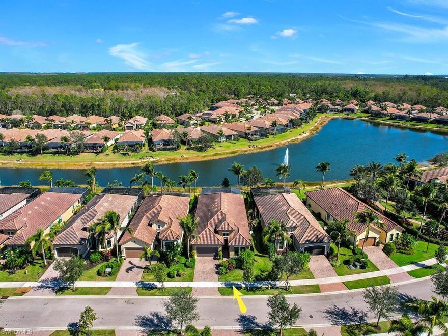 Beautiful 2014 lakefront home in a gated community only 6 miles from the Gulf in exceptional condition! Built by Minto Communities, the Venecia floor plan with 3 bedooms plus a den features a stunning entry foyer which opens directly onto the formal dining room and the great room with tray ceilings, the sunny covered lanai and screen enclosed heated pool/spa area with a lake view beyond. The well-appointed gourmet kitchen boasts a large center island, rich wood cabinetry, ample cabinet and granite counter space. The primary bedroom suite includes dual walk-in closets, and luxurious primary bath with dual vanities and a large glass-enclosed shower. Additional bedrooms share a full bath and inside laundry room with ceramic tile floors throughout. Many upgrades and features as well as impact doors and windows for storm protection! Bonita Isles offers resort-style living with a clubhouse, large heated pool, exercise room, tennis courts, pickleball, outdoor grill area, activities calendar & more! Conveniently located near golf courses, shopping, dining & entertainment venues. Minutes to beautiful Gulf of Mexico beaches and RSW! LOW HOA fees & NO CDD!