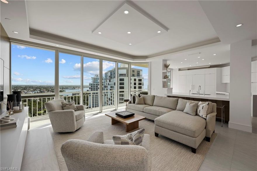 C12837 This rarely available turnkey furnished penthouse with sleek lines and minimalistic design is the epitome of contemporary luxury. Whether enjoying the sweeping views or entertaining guests in the state-of-the-art kitchen, this unit provides an unmatched living experience that is both luxurious and sophisticated. No detail was overlooked, from top-of-the-line appliances and fixtures to elegant finishes such as quartz countertops, remote shades, free-standing soak tub, custom closets, solid core doors, and custom cabinets. High ceilings and skylights provide natural light, and floor-to-ceiling windows offer unobstructed views of the bay and beach. This open and airy feel allows you and your guests to fully appreciate the beauty of the surrounding area. Two premium parking spaces on the enclosed lobby-level garage, and an additional storage locker, are included. Bay Shore Place offers 24/7 security and is pet friendly with two pets under 20 pounds. Just steps away from world-class dining, and shopping, and is the perfect location for those seeking a beachfront property that offers the ultimate in luxury living.