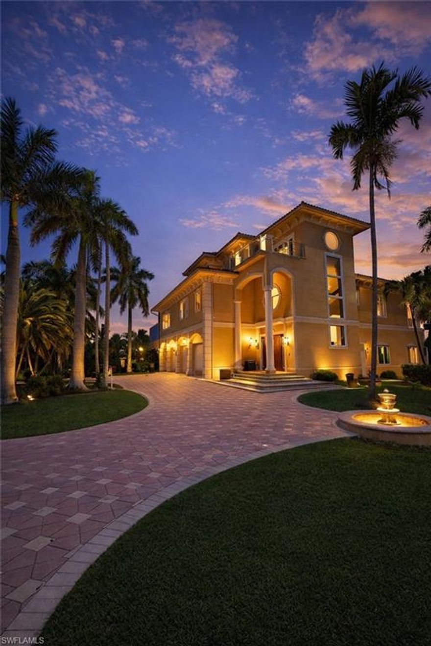 One or more photo(s) has been virtually staged, AI generated or rendered.  Tucked within the prestigious, gated enclave of Barefoot Beach, this exceptional three-story residence offers a rare opportunity to own a coastal retreat with endless potential. Situated on an oversized corner lot, the property boasts beach access along with a private boat dock and lift—perfect for embracing the ultimate Southwest Florida waterfront lifestyle. Designed for both relaxation and entertaining, the home features expansive outdoor living spaces on every level, highlighted by a resort-style pool, spa, and a charming tiki bar. Inside, a gourmet chef’s kitchen is equipped with stainless steel appliances, granite countertops, and ample space for culinary creativity, while a formal dining room provides an elegant setting for gatherings. The spacious master suite serves as a private sanctuary, complete with a sitting area and two exclusive balconies. The master bathroom showcases dual vanities, a freestanding soaking tub, and refined marble finishes, creating a spa-like atmosphere. Please note that the property sustained damage during Hurricane Ian and presents a unique renovation opportunity for buyers looking to customize their dream home in one of the area’s most sought-after communities.