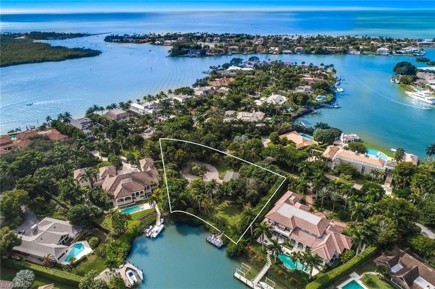 A rare opportunity to BUILD YOUR DREAM on this exceptional waterfront homesite in Port Royal, offering spectacular long views over Harbour Head.  Ideally located where Rum Row meets Admiralty Parade, this oversized GULF ACCESS lot encompasses approximately 1.19 acres with just over 130 feet of expansive water frontage.  Cloistered by lush landscaping and mature trees, this remarkable enclave is all one needs to create a magnificent Naples waterfront lifestyle.  Owners will also be eligible to join the Port Royal Club where members enjoy the finest private club experience including world-class dining, entertainment, private access to a pristine beach with club services, beachside pool, fitness, tennis and spa facilities.  Don’t miss this incredible offering!  Existing structure, dock and outbuildings are being sold as-is.