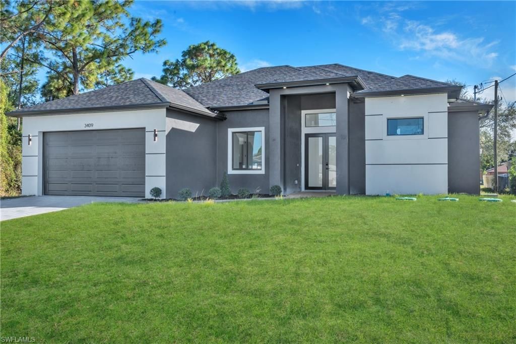 Photo of 3409 24th ST SW, LEHIGH ACRES, FL 33976 (MLS # 226005643)