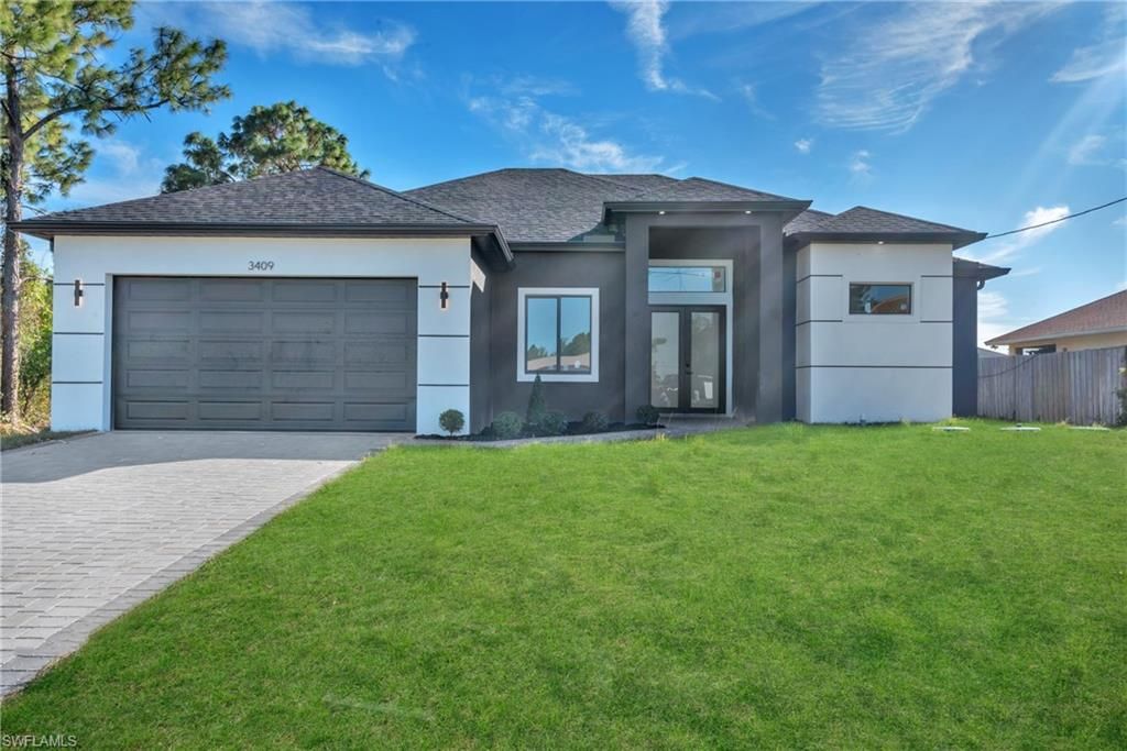 Photo of 3409 24th ST SW, LEHIGH ACRES, FL 33976 (MLS # 226005643)