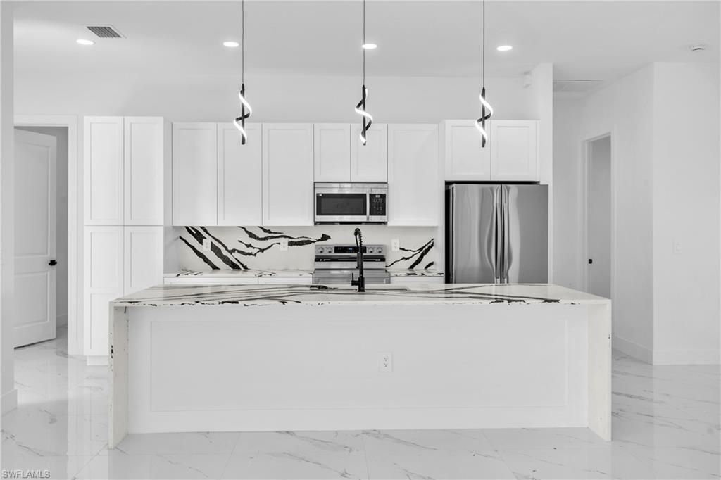 Photo of 3409 24th ST SW, LEHIGH ACRES, FL 33976 (MLS # 226005643)