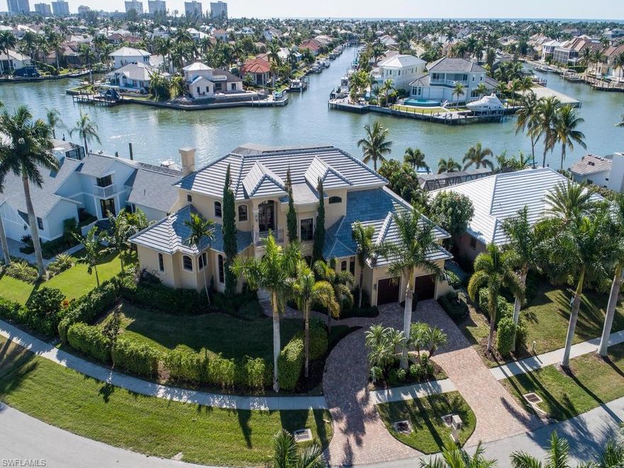 H1018 - This exquisite estate home has it all - stunning views, palatial interior and exterior living, sunny pool/spa and outdoor living, S/W rear exposure, desirable boating, and located in a very private, distinguished area on Marco Island. This luxury, custom built, estate home, built in 2005, boasts superior craftsmanship and attention to detail throughout. Palatial interior and exterior living with 4 bedrooms, 4.5 baths, office, a recreation/billiard room which could be converted into a theater room, pool/spa, wine cellar, and spacious lanai with summer kitchen. Captivating views from many vantages points in this luxury home whether focused out to Smokehouse Bay, down the intersecting waterway, or the spectacular sunsets. The open floor plan and palatial outdoor living area is inviting and provides the perfect destination for entertaining or relaxing while overlooking the beautiful waterway. The second story balcony also provides another outdoor entertaining area which also provides stunning waterway views. Boaters delight with quick, direct access through Collier Bay to the river and Gulf of Mexico. This one-of-a-kind home is perfect for the most discriminating buyer.