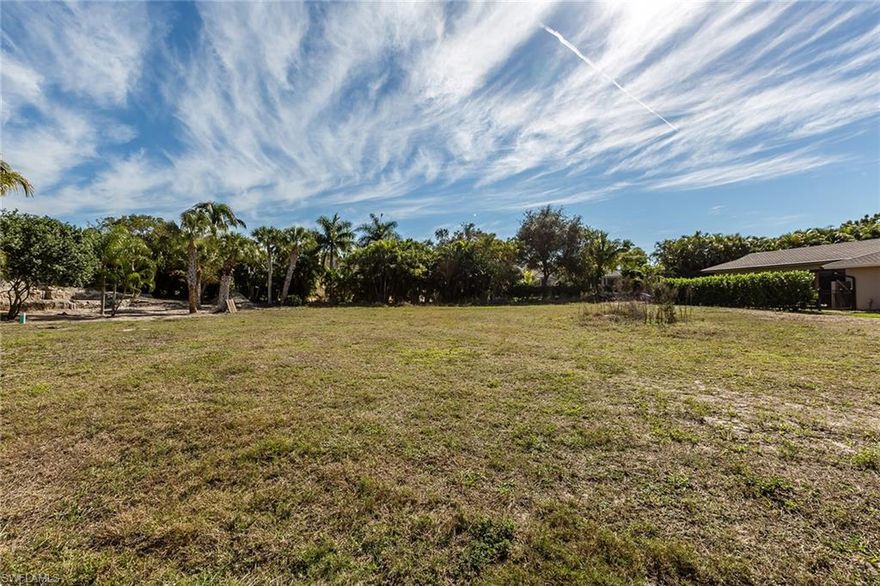 Higher elevation lot located in the prestigious estates area of Marco Island. A large lot to build your custom multi-story home with extra garage space and rooftop terrace providing beautiful views of Robert's and Barfield Bay. Surrounded by many Luxurious homes. Lovely mature Palm trees on the property. Total privacy can be easily achieved.