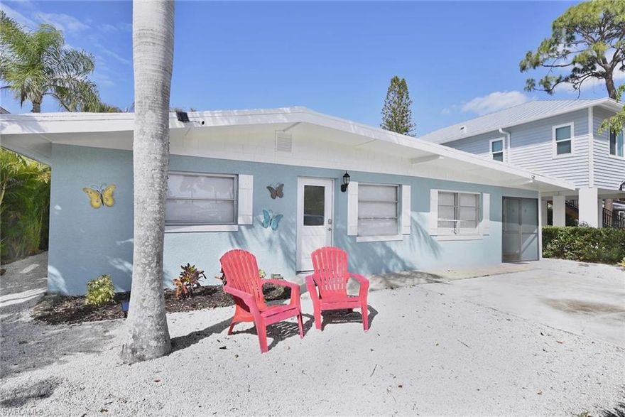 Walk to the beach from this newly renovated 3/2 beach house. New impact door & windows and beautifully remodeled kitchen. Nothing to bring except your toothbrush. Totally turnkey for investor or seasonal living or year round.