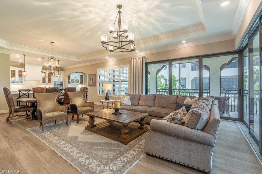 Availability for Long Term "Turnkey" Annual Lease for $11,000 per month starting June 1, 2026. Nestled within the prestigious Talis Park community in Naples, Florida, 16375 Viansa Way #102 offers an exquisite blend of luxury and comfort. This 2,950-square-foot penthouse-style condominium features 3 bedrooms and 3.5 bathrooms and a den providing ample space for both relaxation and entertainment. Constructed in 2020, the residence boasts modern architectural design and high-end finishes throughout. The open-concept layout seamlessly connects the living, dining, and kitchen areas, creating an inviting atmosphere for gatherings. Large windows and sliding glass doors allow natural light to flood the interior, highlighting the elegant tile flooring throughout and contemporary fixtures. The gourmet kitchen is equipped with top-of-the-line appliances, custom cabinetry, and a spacious island, catering to culinary enthusiasts. Each bedroom offers a private retreat, with the primary suite featuring a luxurious en-suite bathroom with double vanities, separate soaking tub, and walk in shower and generous closet space. Residents can enjoy serene GOLF COURSE and lake views from the private lanai, perfect for morning coffee or evening relaxation. Close proximity to the Sports Complex (lap pool, Bocce ball and lighted Tennis & Pickleball Courts near the south entry gate). The "Vyne House" Clubhouse was (voted Clubhouse of the year 2016 by Golf Inc. Magazine!) It offers Core Fitness Center & Esprit Spa plus Fiona’s Market Café! The golf course was designed by Greg Norman and Pete Dye and is ranked by Golf Digest as one of Florida's top 20. SPORTS MEMBERSHIP transfer available with limited golf during season and unlimited golf off season! Play golf and dine at 20+ reciprocal clubs from May-Sept.