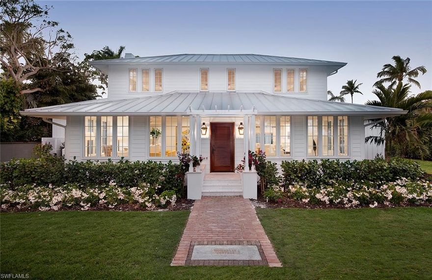 The historic Immokalee Cottage (a/k/a the Wedding Cottage) c. 1920 is a prominent landmark property located in the heart of Olde Naples and within steps to the beach, and a block to celebrated 3rd St. amenities.  This property truly represents a once in a lifetime opportunity to own one of the most extraordinary properties in Olde Naples.  A very unique compound set upon an oversized 115x150 lot featuring a completely modernized main home, two renovated 1-bedroom cottages, and a new 2-car carriage house with storage - all wrapped around one of the finest outdoor living areas in town.  This complete and total renovation includes an open floor plan and a grand first floor master suite - each opening onto an expansive resort-inspired patio, pool, and spa area. Late afternoons and early evenings can be made even more delightful by enjoying the outdoor fireplace after a day at the beach or after enjoying the 3rd Street restaurants and shops.