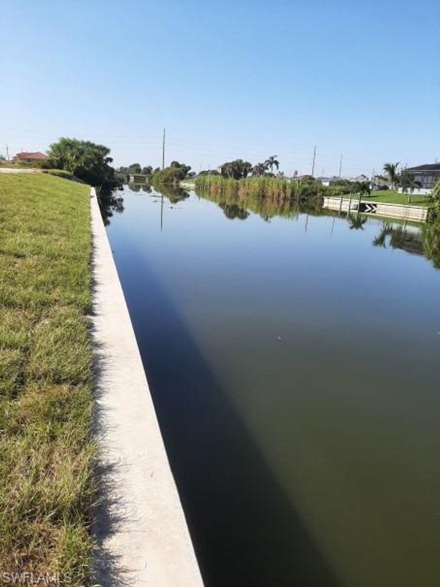 HUGE Price Drop!!! Start Building TODAY!!! Water Front Site on 120' Wide Eureka Canal complete with Brand New Seawall*Cleared and Ready for Your Custom Dream Home, Experience Sunsets on this Western Exposure Piece of Paradise*Access 9 Lakes from Your Own Home along with Miles and Miles of Canals on One of the Largest Canal Systems in Cape Coral or just Sit Back, Relax and Fish from the Luxury of Your Own Home*Site Across Canal also has Seawall so You Get the Full Expansive View*Brand New Homes Going Up to the Left, Right and Across the Street*Builders Take Notice-This One is Ready to Build and Profit*Give Away Price - Don't Delay and See This Today