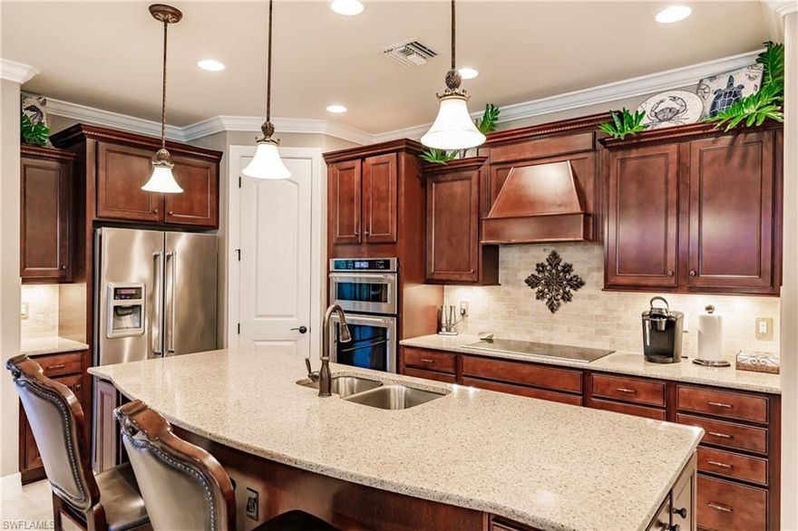 Absolutely Masterpiece home, fully upgrade, customized, and is MOVE-IN READY! Walkthrough the beautiful glass front door to a warm upgraded beige wood-plank tile and walk through the arched entryway into the open living area. Enjoy the matching maple Cabinets with Java glaze in the kitchen and bathrooms topped with beautiful white quartz countertops. The living area is simply perfect for entertaining, dining, cooking, and relaxing with the custom masonry wall, electric fireplace, and Sonos sounds system throughout the home. Step through the French doors into your office, complete with hickory wood floors and real brick accent wall. Storage space is no issue with an oversized laundry, complete with a full set of upper and lower cabinets decorated with the ever-popular subway tile. An additional great feature is the 4-foot extended garage space. The home features all hurricane windows and doors with the plantation shutters. Relax and enjoy the perfect Florida lifestyle in your custom pool featuring a waterfall, brand new water heater, Florida Cypress lanai ceiling, tropical ceiling fans, Sonos sound system, screened enclosure, and full privacy landscaping. This home is a MUST SEE!