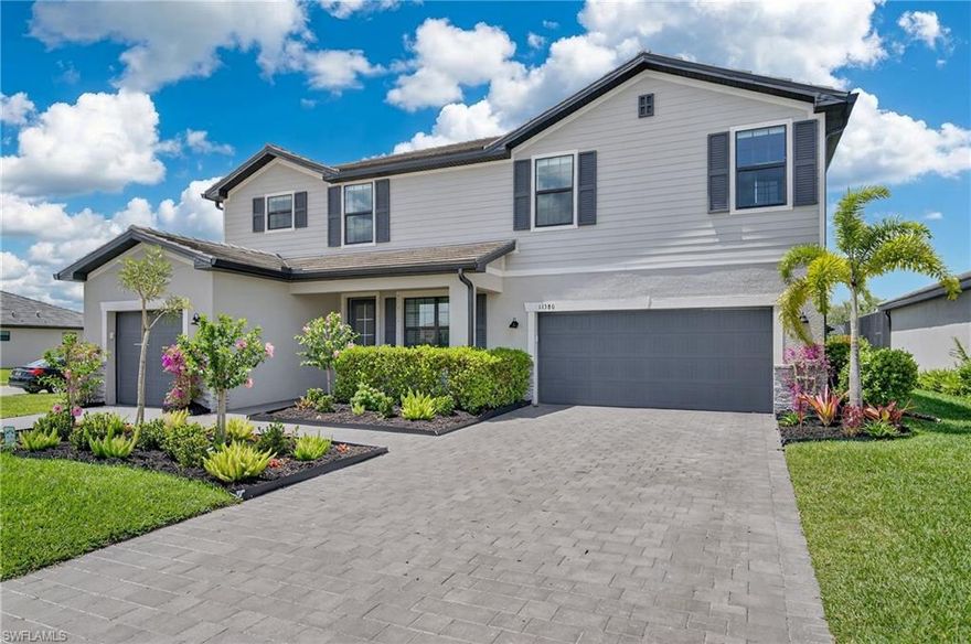 This Sorrento model was built for the way families actually live. With five bedrooms, 4.5 bathrooms, with over 3,350 square feet of living area there’s room for everyone without sacrifice. From the moment you walk in, the soaring 20-foot ceilings in the main living area make an immediate statement, while the elegant dining room with custom accent wall sets the tone.
The heart of the home is the oversized island kitchen, complete walk-in pantry, and a bright breakfast nook. Large sliding glass doors open to the screened lanai, creating that seamless indoor-outdoor Florida lifestyle.

Upstairs, the layout continues to impress with a spacious loft and four additional bedrooms. The primary suite features dual walk-in closets with custom built-in systems and a beautifully appointed bathroom with separate vanities and a walk-in shower. This home is loaded with upgrades that matter: custom closet systems throughout, upgraded lighting, matte black fixtures and hardware, accent walls, additional blown-in insulation for efficiency, and power-operated smart blinds—including blackout shades in the bedrooms. Even the garage is dialed in with epoxy floors and overhead storage racks. And yes—the golf cart is included.
Step outside and enjoy a large fenced backyard made possible by the corner lot location.

Timber Creek takes it even further with a true resort lifestyle. Residents enjoy a guard gated community entrance, stunning clubhouse, multiple pools, a kids water park, restaurant and bar, fitness center, sauna, indoor playrooms, covered basketball, volleyball, tennis, pickleball, and more. All of this just minutes to RSW International Airport, I-75, and with a new Publix coming right next to the community for ultimate convenience.