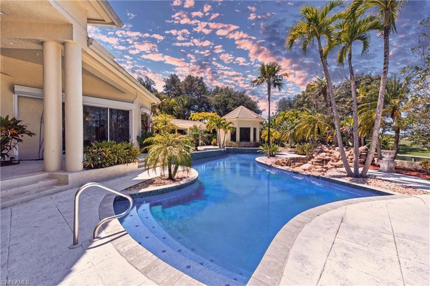 Discover an extraordinary masterpiece by Shane Ames, winner of Best Residential Architecture Firm in North America. Perched on two rare bi-shaped, elevated lots—the only raised lots in the community—this Italianate estate offers breathtaking golf course views, unmatched privacy, and timeless elegance. Designed for entertaining and refined living, the expansive open floor plan boasts high ceilings, sunlit interiors, and a gourmet kitchen with expensive custom-made Italian cabinetry, new countertops, and top-of-the-line appliances. The master suite, with its exquisite Portuguese marble flooring and spa-like bathroom, provides a serene retreat, while a separate guest house ensures added privacy and comfort for visitors. Step outside into your private tropical oasis: an entirely new resort-sized pool with updated equipment, tiles, and a soothing waterfall is the centerpiece of this stunning outdoor space. The spacious patio, cabana, and spa create the perfect setting for hosting gatherings or relaxing in style. With a brand-new roof, grand entrance, and freshly renovated interiors, every detail reflects modern luxury and meticulous care. Located just 10 minutes from pristine beaches and upscale shopping, this estate is both secluded and convenient. Opportunities to own a home of this caliber are rare—schedule your private showing today to experience the height of luxurious living! One or more photo(s) has been virtually staged, AI generated or rendered.