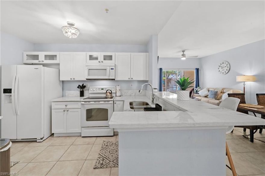 Beautifully updated and move-in ready, this fully furnished 3-bedroom, 2-bath condo in Bellamar offers a clean, modern feel with thoughtful upgrades throughout.

The kitchen has been refreshed with white cabinetry, updated countertops, and a functional breakfast bar that opens to the main living space—perfect for everyday living. The open layout flows into a comfortable living area and private screened lanai, creating an easy indoor-outdoor setup.

Both bathrooms have been tastefully renovated, featuring modern tile work, upgraded vanities, and a sleek glass-enclosed shower/tub combination. Durable flooring runs throughout the home, and all bedrooms are comfortably furnished, making this a true turnkey opportunity.

Additional features include:
 • In-unit washer & dryer
 • Fully furnished throughout
 • Gated Access
 • Beautiful community pool
 • Smart lock entry for convenience

Located in the gated Bellamar community, residents enjoy access to a community pool, fitness center, and convenient proximity to Fort Myers Beach, Sanibel, shopping, and dining.

Available for annual lease only. No pets for tenants per HOA rules.