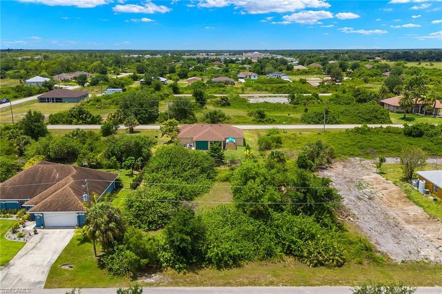 An exceptional opportunity awaits you to build your ideal home with coveted Western exposure on a nice-sized lot in Lehigh Acres. Consider the neighboring .24-acre lot also available for purchase, opening doors to expansive possibilities like creating a compound for multi-generational living. Alternatively, envision your perfect home adorned with outdoor luxuries such as a pool, garden, or entertainment area, with ample space at your disposal. Embrace the freedom of no HOA fees, allowing unfettered creativity. Surrounded by new construction homes and established residences, the area promises growth. Ideally situated in a prime locale, ensuring easy access to schools, groceries, dining, and recreation. Tucked away in a serene neighborhood, it offers a tranquil escape from the hustle and bustle. Seize the chance to secure your forever home or investment property in this idyllic setting. Your blank canvas awaits!