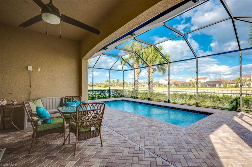 LOCATION, LOCATION -  This highly updated, light & bright, cheerful, modern home is located in Prime Naples in the BEST School district! Tile flooring thru out with Engineered Hardwood in all bedrooms, French Doors in Formal Dining/Den ~ Relax in your extended caged Lanai with heated Pool overlooking a serene Lake~ Custom painted tray ceilings, custom paint in bedrooms, Stainless Steel appliances, Backsplash extended to ceiling, Large pantry, Modern designer type ceiling fans throughout,  Garage Floor features epoxy protective layer. HUGE walk-in closet in Master.  This perfectly located GATED community, with LOW HOA fees, features a Clubhouse, Lap pool, BBQ area, Exercise Room, Basketball and so much more.  Schedule your private showing Today!