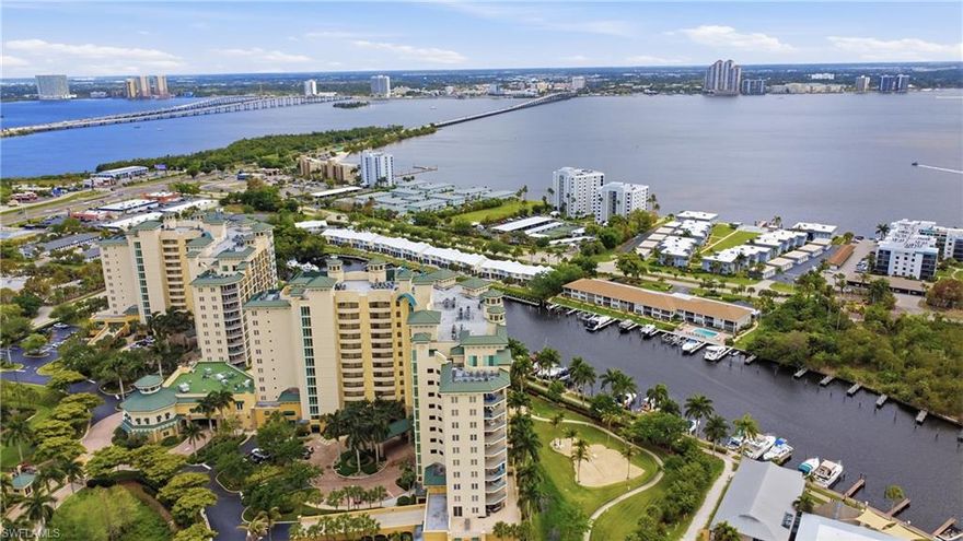 Exceptional furnished long term rental in North Star Yacht Club!  Breathtaking Riverfront Living–Sunrise Views from the 9th Floor! Wake up to panoramic sunrise views over the glistening Caloosahatchee River from this stunning 9th-floor retreat at the prestigious North Star Yacht Club. This beautifully upgraded Libra model showcases the very essence of Florida waterfront living — where luxury meets lifestyle, and every day feels like a vacation. Step into 1,931 square feet of thoughtfully designed elegance, featuring soaring 9-foot floor-to-ceiling impact glass windows that flood the space with natural light and frame jaw-dropping vistas of the river, resort-style pool, and private marina. Whether you're sipping coffee at sunrise or enjoying a glass of wine at dusk, the southeastern exposure ensures your home is always bathed in warmth and beauty. The open-concept floorplan flows effortlessly, with hardwood flooring throughout the entire unit and tile in baths and laundry room. Recent updates include: Custom motorized electric shades throughout, modern light fixtures and ceiling fans. Decorator furnished and finished with fresh paint and crown molding throughout. Your spacious owner’s suite is a sanctuary of comfort, complete with dual walk-in closets featuring custom shelving, and a spa-inspired bath with separate vanities, a soaking tub, and walk-in shower — perfect for unwinding after a day on the water. Bonus features include a rare extra a private storage locker, and two covered parking spaces—a convenience few units offer. Resort-Style Amenities on the Waterfront North Star Yacht Club sits on over 12 acres of lush, manicured grounds along the riverfront, offering an unmatched array of amenities that cater to your active and social lifestyle: Expansive resort-style pool and spa Lap pool, BBQ areas, and scenic walking trails Tennis, pickleball, bocce ball, and volleyball courts Private dog park just expanded State-of-the-art fitness center and yoga studio Theater room, billiards lounge, business center, and renovated clubhouse with kitchen A vibrant community with regular social events, fitness classes, and clubs Follow the private path along the waterfront to restaurants, cafés, salons, and boutiques—all just a stroll away. If you've been dreaming of a sophisticated, low-maintenance lifestyle on the water — where luxury meets community and every detail is taken care of — this is your moment. Live the Waterfront Life at North Star!